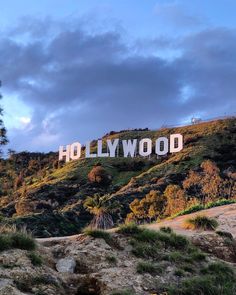 the hollywood sign is on top of a hill