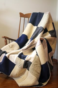 an image of a blue and white blanket on a chair with the caption below that reads, yellow mismatched old sweaters cut them into squares