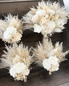 wedding bouquets with flowers and feathers on the stairs