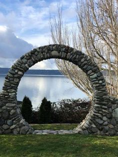 an arch made out of rocks near the water