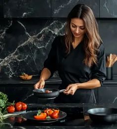 a woman is cooking in the kitchen with her skillet and vegetables on the counter