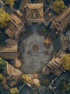 an aerial view of a courtyard with tables and umbrellas in the center, surrounded by trees