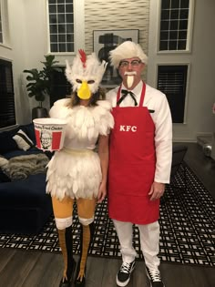 two people dressed up as chicken and rooster