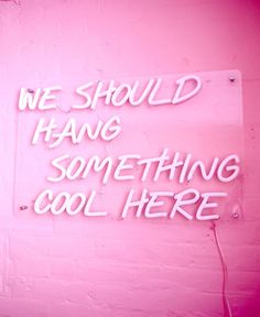 a neon sign that says we should hang something cool here