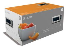 an orange and white box containing a microwave oven with vegetables in it on a white surface