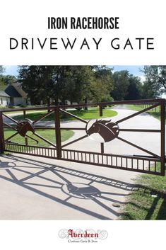 an iron gate with the words iron racehorse driveway gate