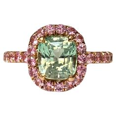 A beautiful chrysoberyl with an unusual pastel green colour set with light pink sapphires in 18k rose gold. The pink sapphires are set approximately 2/3 of the way around the band. The ring is hand-made in Geneva, and is a perfect fit for the little finger. The chrysoberyl weighs 1.66 ct and the 35 pink sapphires weigh 0.64ct. Colour Set, Green Sapphire Ring, Pink Sapphire Ring, Green Sapphire, Green Colour, Pastel Green, Jewelry Maker, Pink Sapphire, Color Set