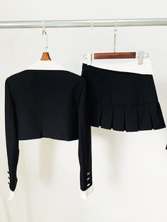 Experience the ultimate in style with this women's crop jacket and mini skirt set. The single button closure, trendy notched collar, and charming pleated mini skirt create a fashion-forward ensemble. Crafted from high-quality polyester, it guarantees both comfort and a chic look, making it perfect for the summer season. Stay effortlessly on-trend with this must-have two-piece set.Specifications Style: High Street Sleeve Style: Regular Sleeve Length(cm): Full Silhouette: Pleated Season: Summer Place Of Origin: China (Mainland) Pattern Type: Solid Pant Closure Type: Zipper Fly Origin: Mainland China Model Number: TS161 Material Composition: Natural fiber Material: Polyester Gender: WOMEN Fabric content: 81% (inclusive) - 90% (inclusive) Fabric Type: Polyester Cotton Dresses Length: Above Kne Fitted Two-piece Long Sleeve Blazer, Chic Mini Skirt Sets For Fall, Chic Fall Sets With Mini Skirt, Fitted Mini Skirt With Fake Two-piece Design, Fitted Mini Skirt With Fake Two-piece Detail, Chic Mini Length Fall Sets, Fitted Fake Two-piece Mini Skirt, Chic Fall Mini Length Sets, Pleated Sets For Spring