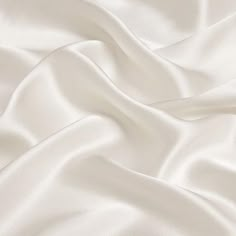 40mm silk satin fabric, 114cm wide, ivory color. For silk satin we have 16mm, 19mm, 30mm amd 40mm. Many colors in stock. 100％ silk. We also can customize for you based on your color and pattern. Any questions or comments on silk fabric, please feel free to let me know. How to care silk fabric: Satin Fabric Images, Brilliant White Fabric, Luxury White Silk Evening Dress, Silk White Blanket, White Fabric For Dresses, Whitw Satin Wallpaper, Satin Wallpaper Silk Beige, Cotton Silk Clothing Fabric, Satin Bedding White