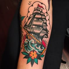 a tattoo with a ship on it