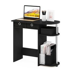 a black computer desk with a laptop on top and magazines under the shelf next to it