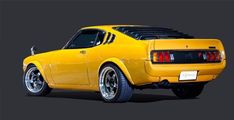 the rear end of a yellow sports car