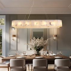 a dining room table with six chairs and a chandelier hanging from the ceiling