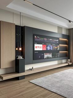 a large flat screen tv mounted to the side of a wall in a living room