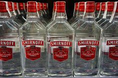 bottles of smirnoff vodka are displayed for sale