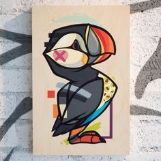 a painting of a toucan bird on a wall