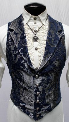 "A Victorian gentleman's vest with class. Great for formal occasions, can be worn under a suit jacket or by itself. Made in rich silver on black tapestry fabric with black satin lining and back. This vest has a very flattering tapered fit and ties in back with satin belting so it can be made tighter in the waist. Fastens in front with six metal buttons. A notched collar adds extra style. Comes in sizes small-3X. Smooth! Size small = chest 39\" waist 36\" Size medium = chest 42\" waist 38\" Size Aristocrat Vest, Victorian Men, Victorian Gentleman, Victorian Man, Victorian Clothing, Mens Vests, Fantasy Clothing, Fantasy Fashion, Character Outfits