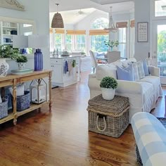 a living room filled with furniture and lots of windows