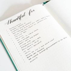 an open notebook with writing on it and the words thank you written in cursive ink