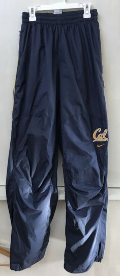 Excellent condition. Mesh lined. Zip pockets. Free shipping in the US. Location: SR-105 Blue Nylon Cargo Bottoms, Functional Blue Nylon Pants, 4-way Stretch Nylon Pants For Gym, Sporty Blue Nylon Pants, 4-way Stretch Nylon Sports Pants, Cal Berkeley, Athletic Pants, Parachute Pants, Zip Pockets