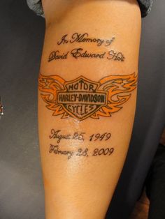 a woman with a tattoo on her arm that reads harley - davidson and the words, in memory of david baldwin