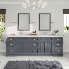 a bathroom with two sinks, mirrors and lights above the vanity area is decorated in white and gray