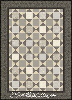 a black and white quilt with grey squares on it's sides, in the center is