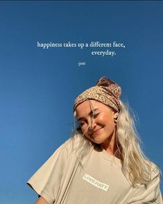 a woman is smiling and holding a cell phone with a quote above her head that says happiness takes up a different face, everyday