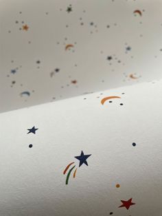 a white sheet with stars and rainbows on it