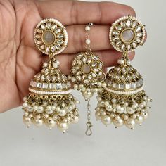 Kundan Tikka Earrings Set Indian Bridal Maang Tikka set Kundan earrings Headpiece Jewelry Bollywood Jewelry Indian jewelry Bridesmaid Gift Dull Gold-plated tikka earring set  Arrives in the gift box. Please let me know if you have any questions. Thank you so much for visiting my shop. Color, shades, and texture displayed may slightly vary from the actual product due to digital image limitations. We request you to consider these minor variations. Please expect the possibility of some slight imperfections when buying handmade jewelry. If you have any questions, please contact us. Bridal Maang Tikka, Maang Tikka Set, Tikka Jewelry, Diy Seed Bead Earrings, Headpiece Jewelry, Jhumki Earrings, Indian Jewellery Design Earrings, Maang Tikka, Bollywood Jewelry