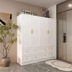 a bathroom with white cabinets and a plant on the floor next to it, in front of a shower stall