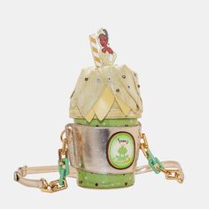 Danielle Nicole Disney The Evening Star Frappuccino Crossbody Tiana Bag Still In Plastic Sip On Sweet Style With The Tiana Frappucino Crossbody. Shades Of Green Mixed With White And Gold Accents Make For A Hoppin’ Look. Featuring Your Favorite Bayou Princess In The Form Of A Delicious Drink, This Whimsical Piece Is Made To Turn Heads. A Chunky Accent Chain And Adjustable Strap Allows Versatility For The Bag To Be Hand-Held Or Worn Over Your Shoulder. Make A Wish, Hold On Tight, And Accessorize W The Evening Star, Danielle Nicole Disney, Walt Disney Princesses, Princesa Tiana, Minnie Mouse Backpack, Evening Star, Sweet 16 Decorations, Toy Story Buzz Lightyear, Disney Charms