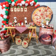 a pizza themed birthday party with balloons, pizzas and other items on the table