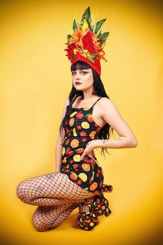 This is a perfect Tropical Tiki Hat!! One of my very favorite pieces!! It is impossible to look at this hat and not smile! It is made with a watermelon sitting front and center with a banana, and gorgeous tropical flowers! Grapes and little sprigs are the detail pieces! You will indeed be a tiki queen in this headdress This is a fruit headdress with red turban attached! Sturdy, lightweight and ready to ship!! Vintage Summer Costume Hats And Headpieces, Fruit Basket Headpiece, Tropical Hat, Fruit Headdress, Nutrition Month Costume, Tahitian Costumes Headpieces, Carnaval Costumes, Mohawk Warrior, Fruit Hat