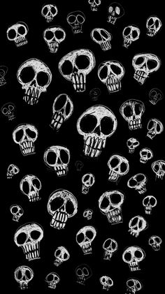 a bunch of skulls that are drawn in chalk