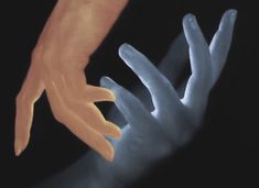 two hands reaching towards each other with their fingers extended in the air, against a black background