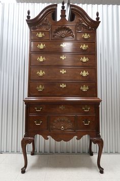 an old wooden dresser with many drawers