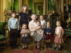 a group of children and an older woman posing for a photo