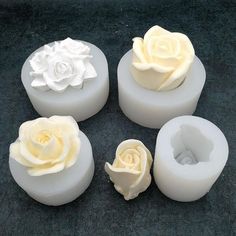 four white soaps with flowers on them