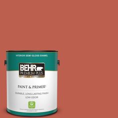 a can of behr premium plus paint and primer in one on a blue background