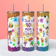 three children's personalized tumbles with glitter on them