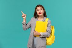 a woman holding a yellow folder and pointing to the side