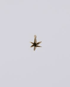 Verve Six Point Star Charm on light color background. Gold Plated Star Charm Necklaces, Gold Plated Star Charm Necklace, Gold Plated Star Charm Pendant Necklace, Yellow Gold Star Charm Necklace, Gold Star-shaped Jewelry With Charms, Jump Ring Jewelry, Solid Gold Charms, Gold Charms, Colorless Diamond