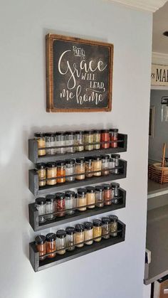 the spice rack is hanging on the wall