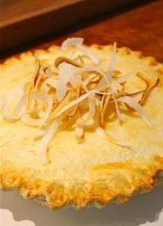 a pie with cheese and onions on it