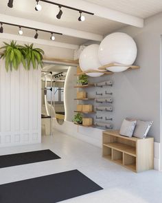 a white room with some shelves and plants