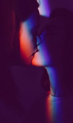 two people with their faces close to each other