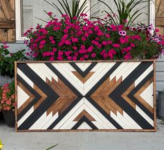 a wooden planter with flowers in it