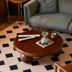 a living room with two couches and a coffee table in front of the couch