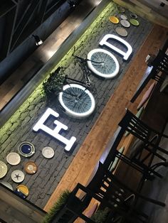 an illuminated sign that reads eod with bicycles on it